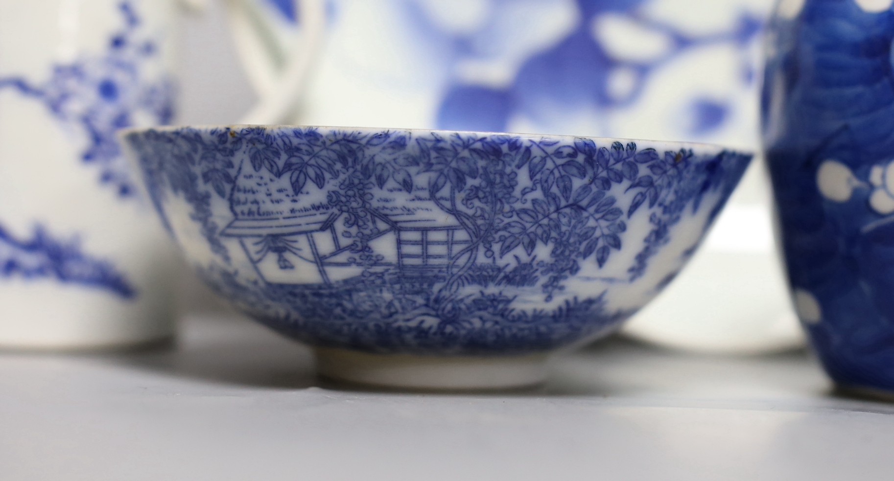 A Japanese Edo period blue and white dish, a Chinese Prunus blossom jar, late 19th century, a provincial blue and white jar and other items, dish 31 cms diameter